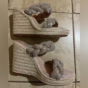 Woman’s sparkly wedge sandal
